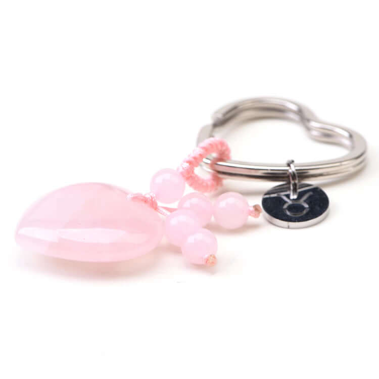 Star Sign Pink beaded keychain with a silver ring and zodiac charm on a white background